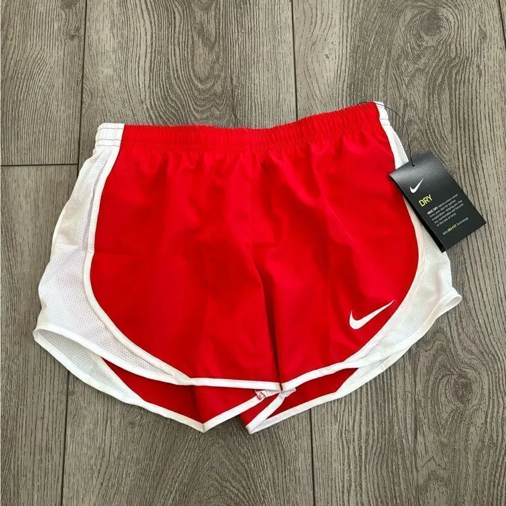 Nike gold running shorts with underwear lining